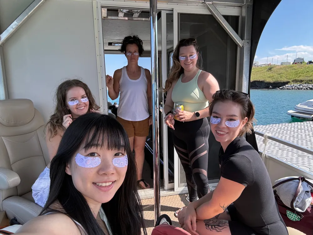 A group photo inside the boat's cabin